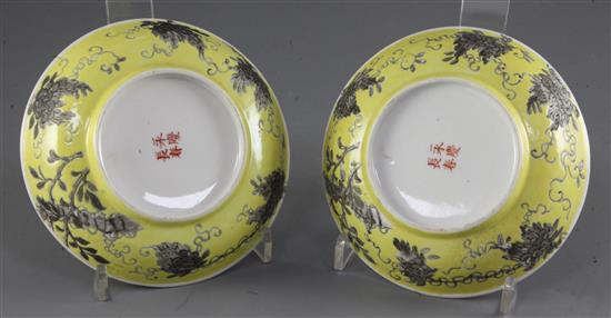 A pair of Chinese Empress Dowager Cixi grisaille decorated yellow ground saucer dishes, Da Ya Zhai marks, diameter 14.5cm
